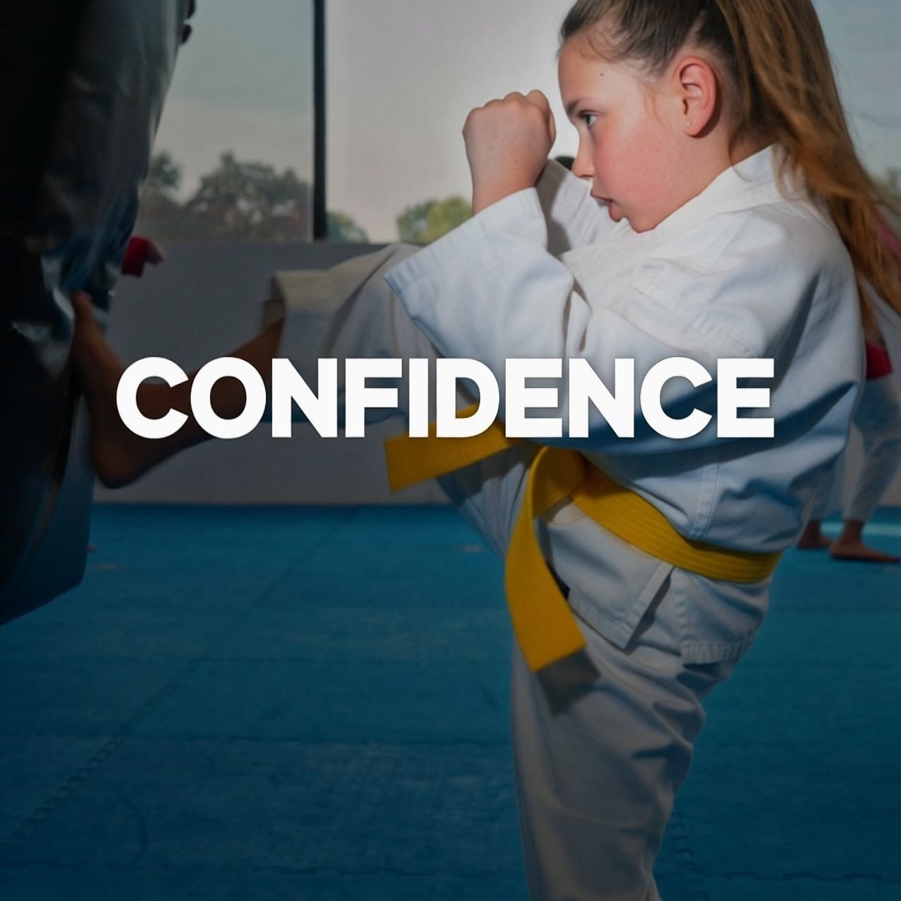 Summer Confidence Course Girl kicking a self defence bag in karate class